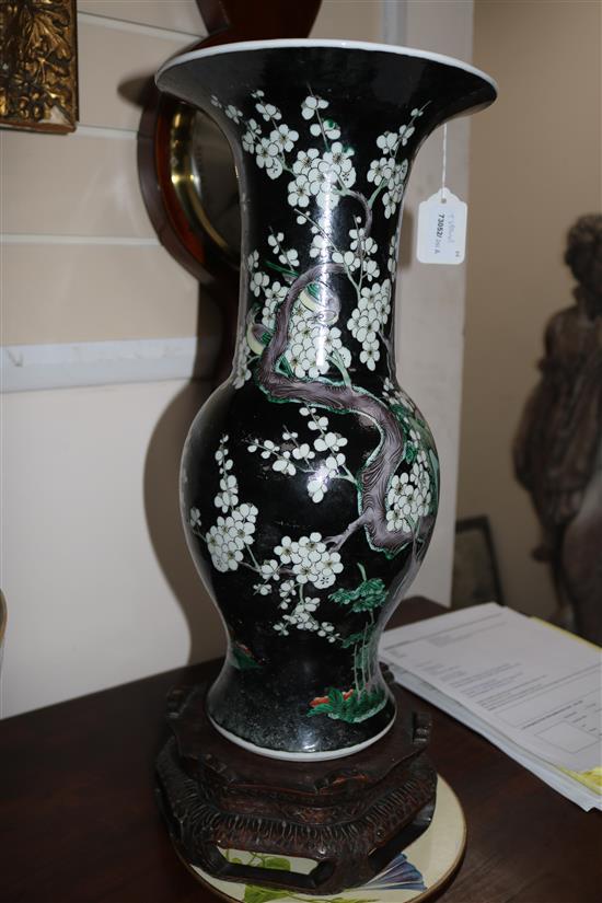 A Chinese famille noir long-necked baluster vase on stand